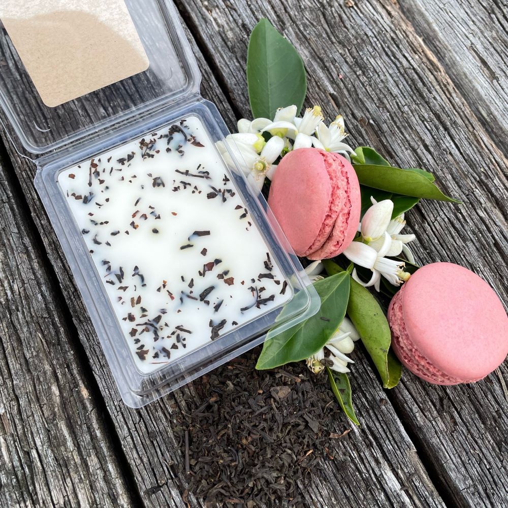 Twig and Feather lychee and black tea soy wax melts with tea leaves
